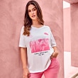 The model is wearing a white shirt with a pink print.