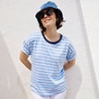 The model is wearing a white-and-blue striped shirt.
