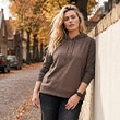 The model is wearing a sweatshirt.