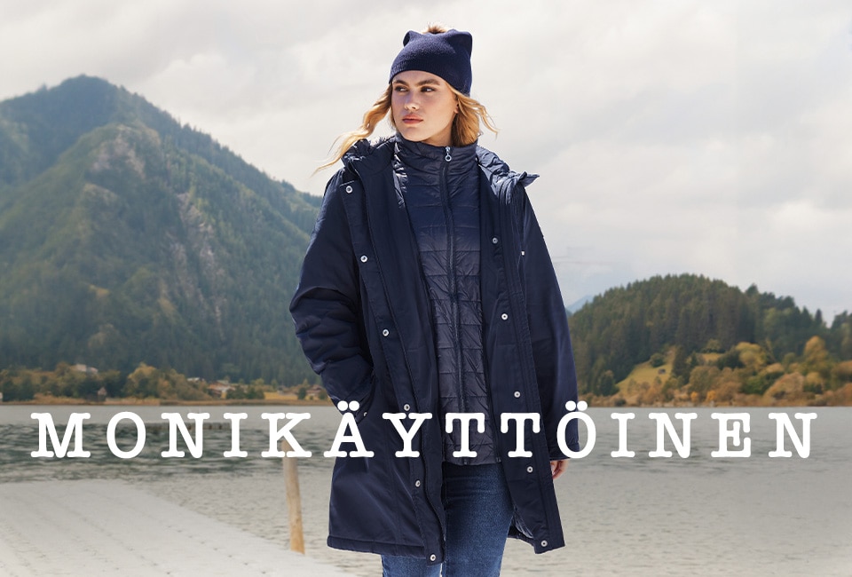 Woman with sweat jacket standing on an footbridge