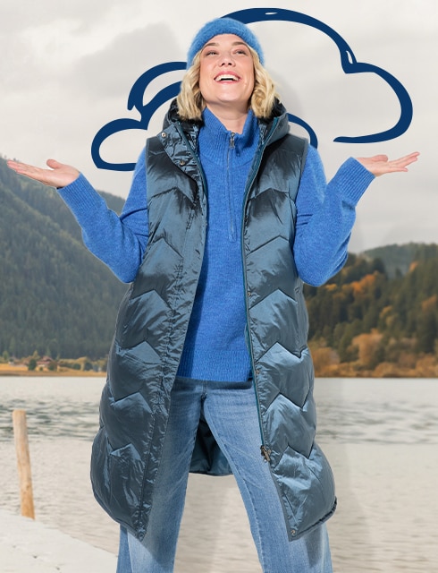 Woman with sweat jacket standing on an footbridge