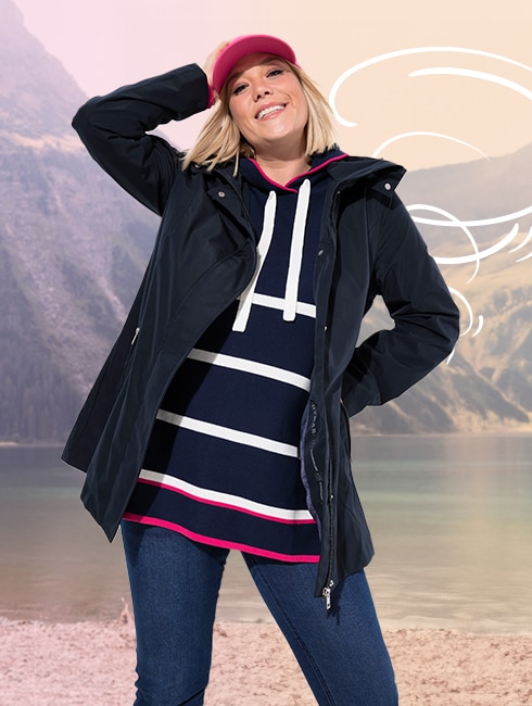 The model is wearing a black functional jacket