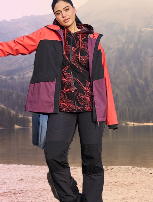 Sustainability Woman with sweat jacket standing on an footbridge