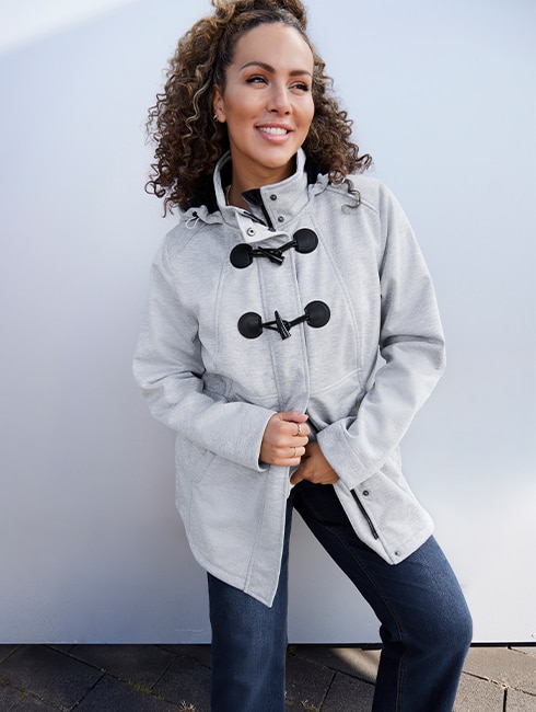 The model is wearing a grey jacket.