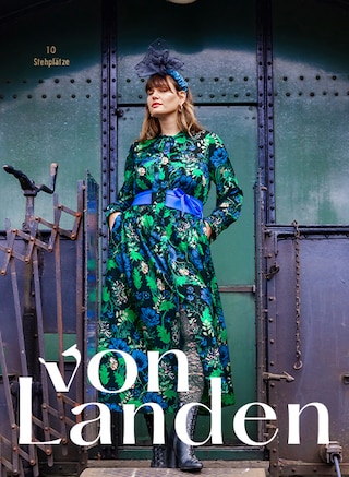 The model is wearing a floral dress from the country house brand “von Landen”