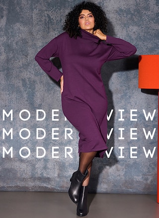 The model is wearing a knee-length knitted dress