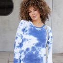 The model is wearing a blue patterned jumper