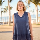 the model wears a grey top