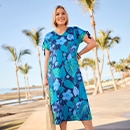 the model wears a blue dress