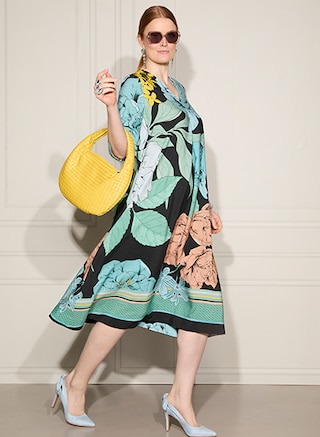 The model wears a dress from Selection