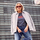 the model wears a shirt with stripes		


