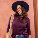 the model wears a purple shirt