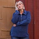 the model wears blue sweater
