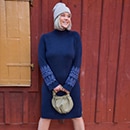 the model wears a dress