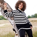 the model wears sweater with black and withe stripes