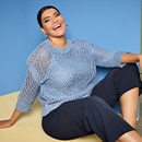 the model wears sweater