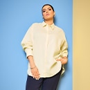 the model wears a yellow blouse 