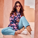 the model wears a blouse 