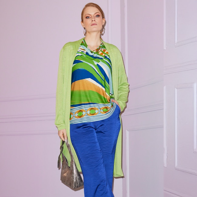 The model wears a colorful shirt 