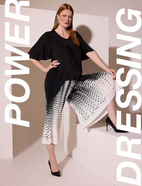 a model is wearing a blouse and pants