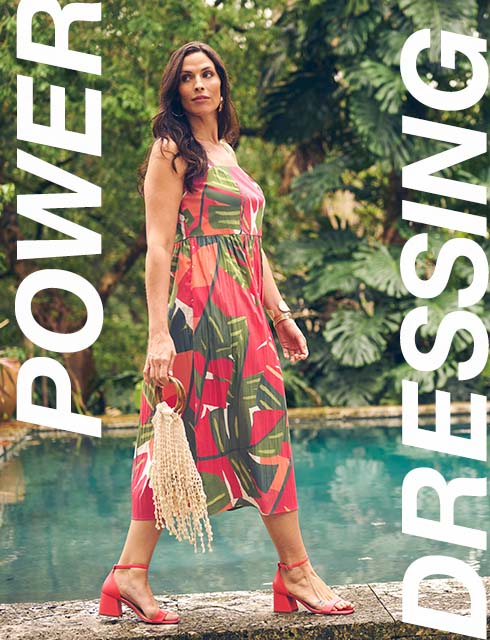the model is wearing a colorful dress.