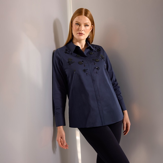 the model is wearing a blouse