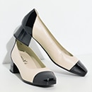 A pair of pumps with decoration on the toe 