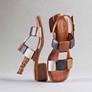 A pair of braided sandals in white silver-grey