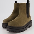 A pair of boots in green suede