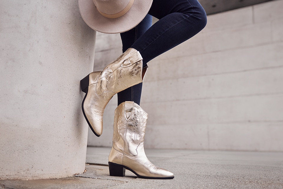 Close-up of the cowboy boots in gold