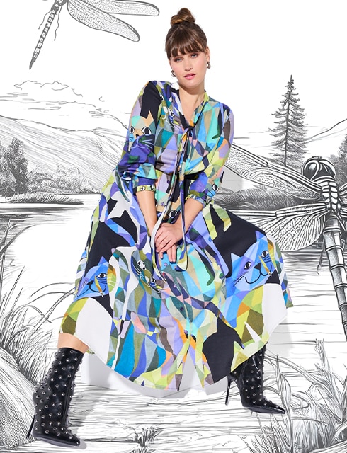 The model is wearing a colorful dress
