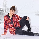 The model is wearing a colorfull blouse