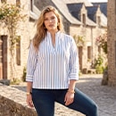 The model is wearing a blouse