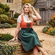 The model is wearing a traditional dress