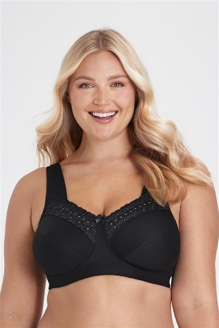 Model trägt einen grünen BH mit breiten Trägern