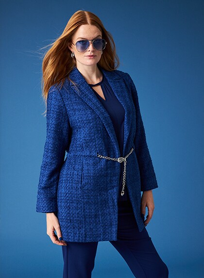 Studio shot of woman in blue jacket