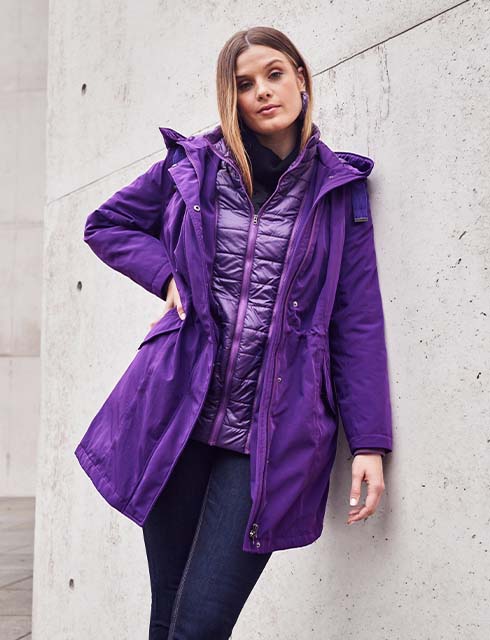 The model wears a waistcoat jacket combination in purple 




