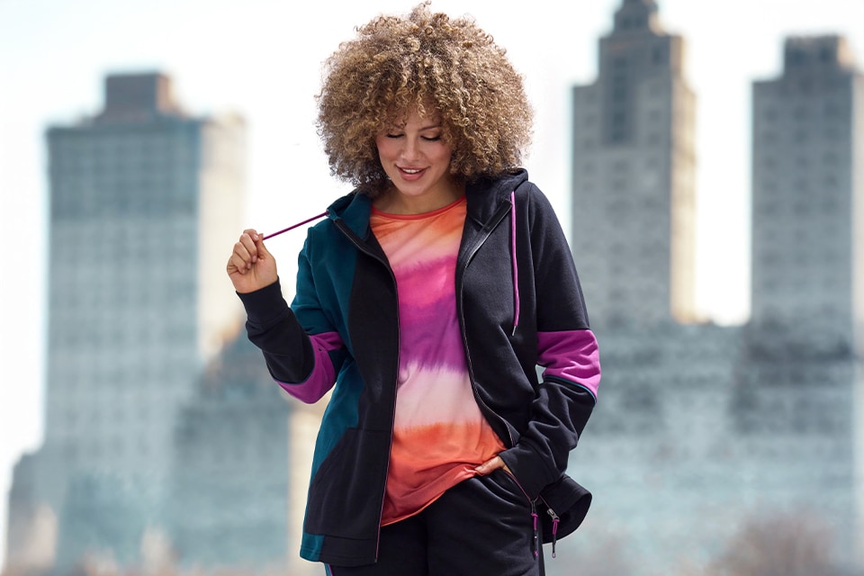 The model is wearing a shirt and a jacket