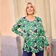The model wears a shirt with pattern